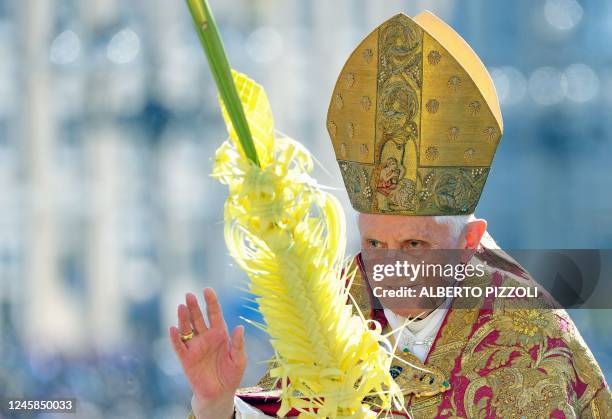 Pope Benedict XVI attends the Palm Sunday procession in Saint Peter's square at the Vatican, on April 17 2011. The Palm Sunday marks the holy week of...