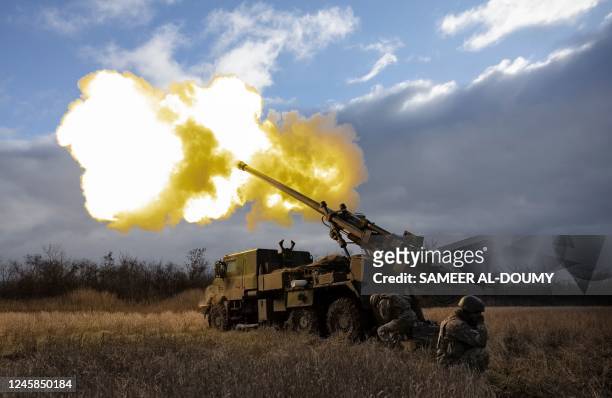 Ukrainian servicemen fire with a CAESAR self-propelled howitzer towards Russian positions in eastern Ukraine on December 28, 2022.