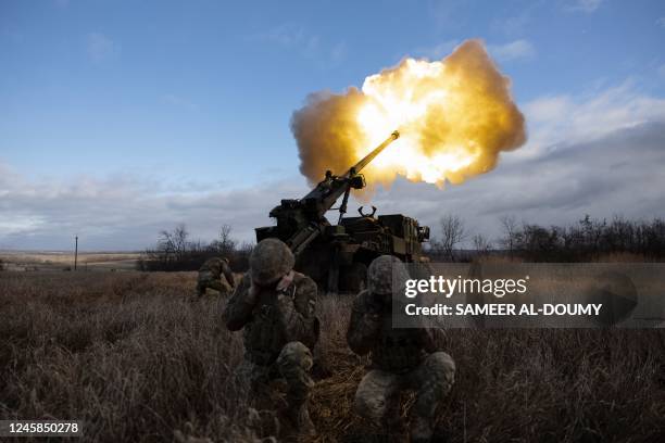 Ukrainian servicemen fire with a CAESAR self-propelled howitzer towards Russian positions in eastern Ukraine on December 28, 2022.