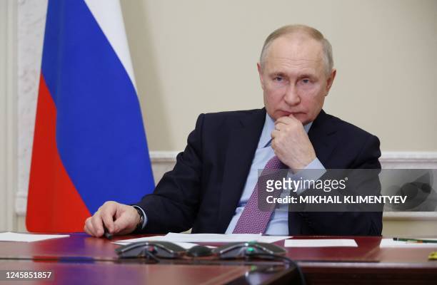 Russian President Vladimir Putin attends a ceremony to launch the Titan-Polymer industrial complex in Pskov region, via a video conference in Staint...
