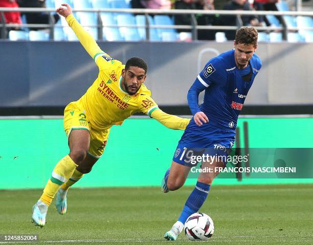 Troyes' defender Andreas Bruus fights for the ball with Nantes' defender Jean-Charles Castelletto d during the French L1 football match between ES...