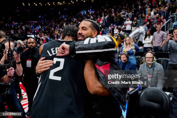 Drake and Kawhi Leonard of the LA Clippers hug after the game against the LA Clippers on December 27, 2022 at the Scotiabank Arena in Toronto,...