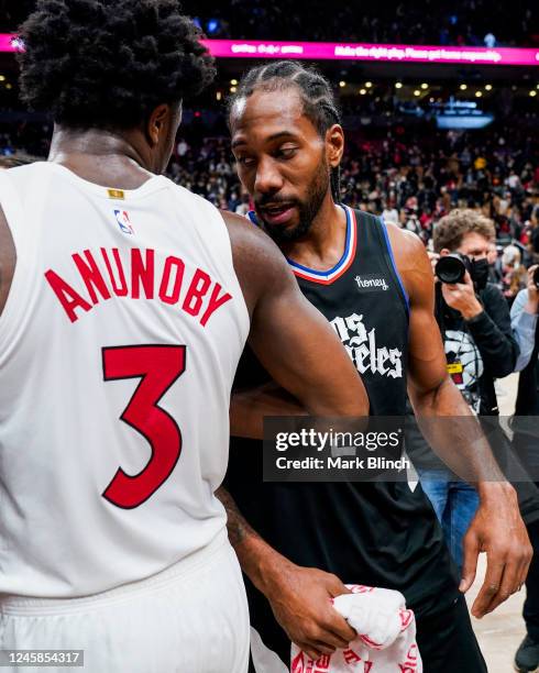 Anunoby of the Toronto Raptors and Kawhi Leonard of the LA Clippers talk after the game on December 27, 2022 at the Scotiabank Arena in Toronto,...