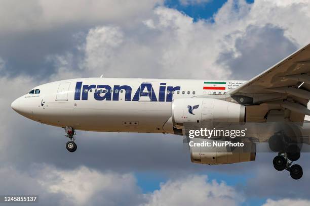 Iran Air Airbus A330 wide-body aircraft as seen landing at London Heathrow International Airport LHR during a blue sky day with clouds. The passenger...