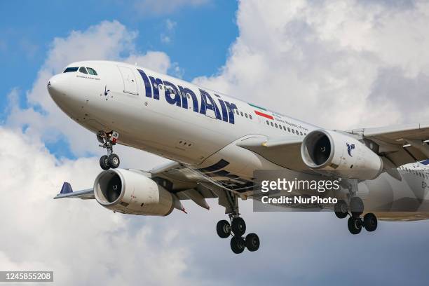 Iran Air Airbus A330 wide-body aircraft as seen landing at London Heathrow International Airport LHR during a blue sky day with clouds. The passenger...