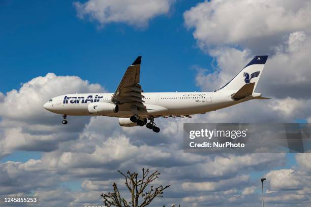 Iran Air Airbus A330 wide-body aircraft as seen landing at London Heathrow International Airport LHR during a blue sky day with clouds. The passenger...