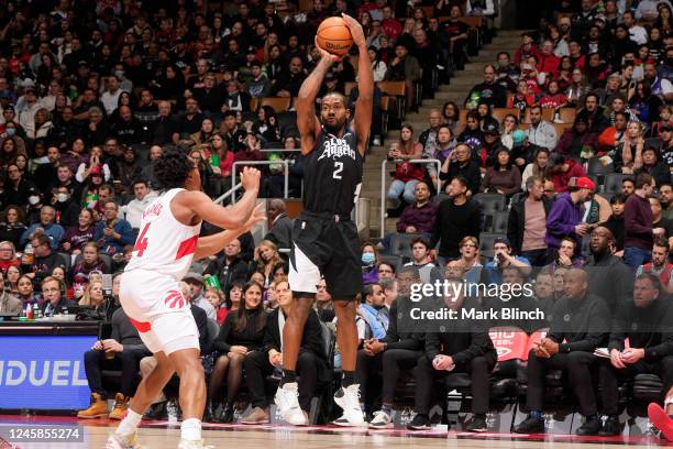 Kawhi Leonard of the LA Clippers shoots a three point basket against the Toronto Raptors on December 27, 2022 at the Scotiabank Arena in Toronto,...