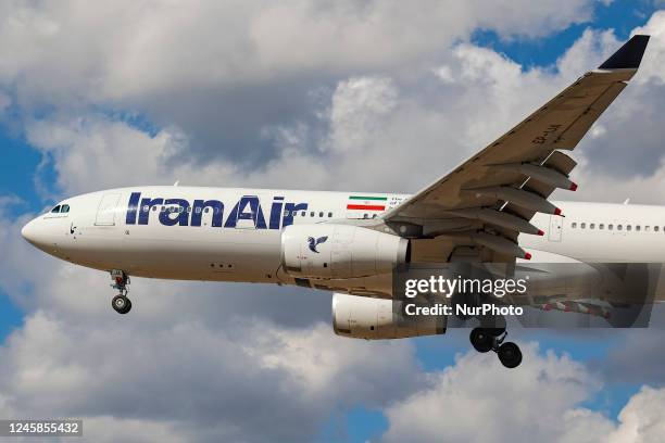 Iran Air Airbus A330 wide-body aircraft as seen landing at London Heathrow International Airport LHR during a blue sky day with clouds. The passenger...