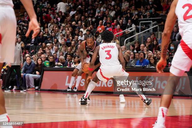 Kawhi Leonard of the LA Clippers looks to pass the ball against the Toronto Raptors on December 27, 2022 at the Scotiabank Arena in Toronto, Ontario,...