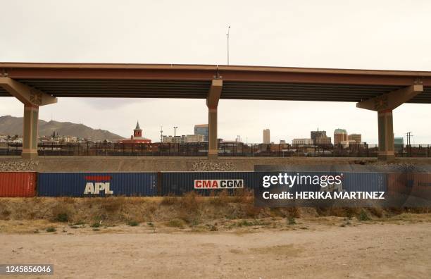 View of cargo containers placed by the United States authorities as a retaining wall on the banks of the Rio Grande in Ciudad Juarez, Chihuahua...