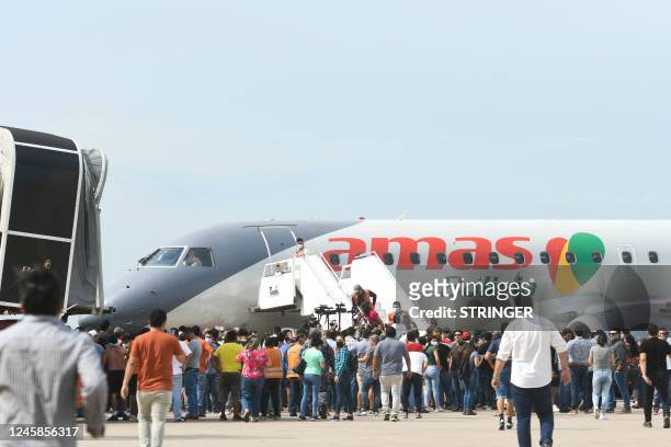 Supporters of Santa Cruz region opposition leader Luis Fernando Camacho stand on the runway to avoid departures of flights at the Viru Viru airport...