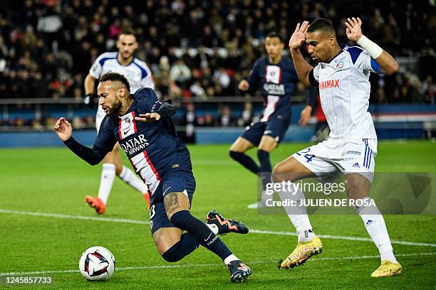 Paris Saint-Germain's Brazilian forward Neymar simulates in front of Strasbourg's Ghanaian defender Alexander Djiku and receives a second yellow card...