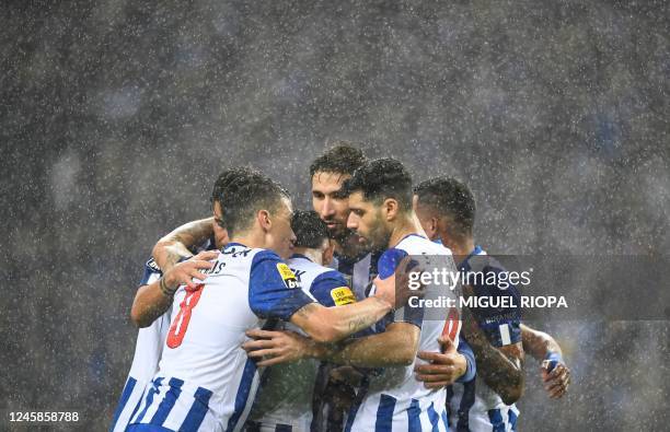 Porto's players celebrate their fourth goal after Iranian forward Mehdi Taremi's hat trick during the Portuguese League football match between FC...