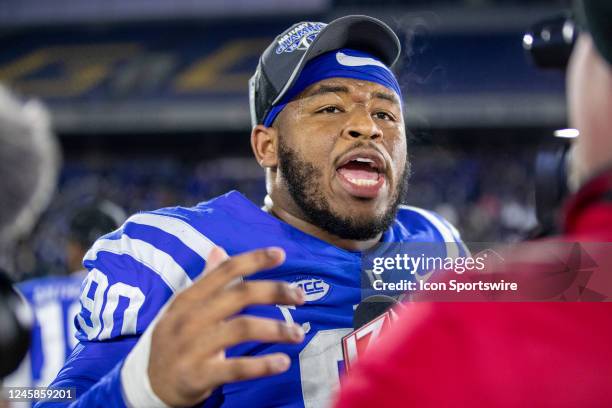 Duke Blue Devils defensive tackle DeWayne Carter talks with media after the Military Bowl between the UCF Knights and the Duke Blue Devils on...