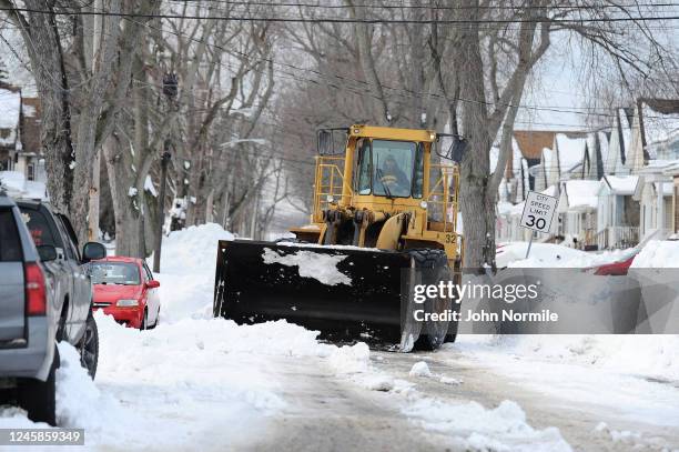 Loader removes snow along Armin Street on December 28, 2022 in Buffalo, New York. The historic Winter Storm Elliott dumped up to four feet of snow on...