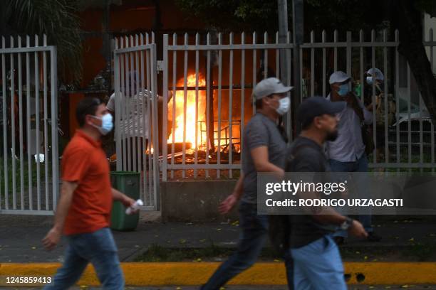 Supporters of Luis Fernando Camacho, a key opposition figure and governor of the economic powerhouse Santa Cruz region, walk outside the prosecutor's...