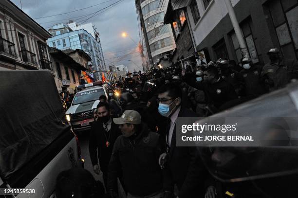 Police officers guard the entrance to the headquarters of the Special Forces for Fight against Crime in La Paz, Bolivia, as Luis Fernando Camacho, a...