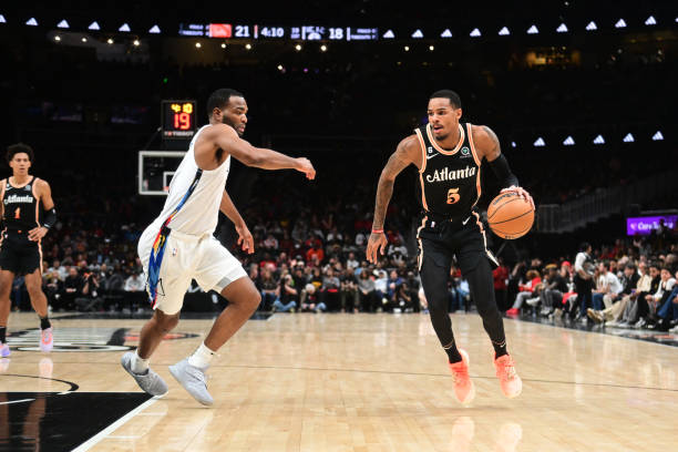 Dejounte Murray of the Atlanta Hawks drives to the basket during the game against the Brooklyn Nets on December 28, 2022 at State Farm Arena in...
