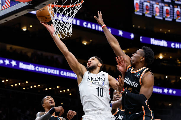 Ben Simmons of the Brooklyn Nets puts up a shot against Onyeka Okongwu of the Atlanta Hawks during the first half at State Farm Arena on December 28,...