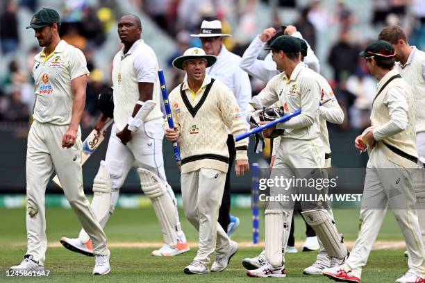 The Australian team walk off after defeating South Africa on the fourth day of the second cricket Test match between Australia and South Africa at...