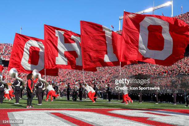 The Ohio State Buckeyes dance team and cheerleaders lead the Buckeyes on the the field prior to the college football game between the Michigan...