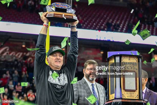 Texas Tech Red Raiders head coach Joey McGuire raises the trophy after winning the TaxAct Texas Bowl between the Texas Tech Red Raiders and Ole Miss...