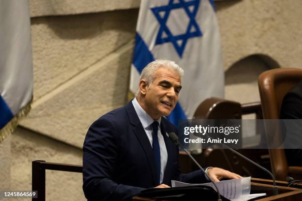 Israeli Prime Minister Yair Lapid speaks at the Israeli parliament during a new government sworn in discussion at the Israeli parliament on December...