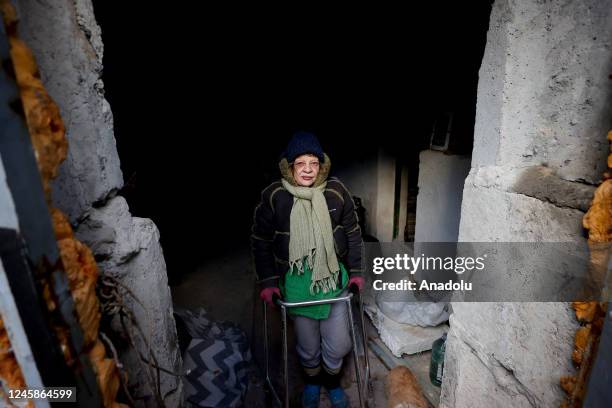 Year-old Irina Vorobyova, a walking disabled woman, walks with a mobility walker in a shelter after her house burns due to missile attack in Kyiv,...