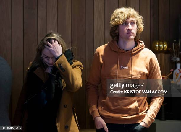 Belgium's cyclocross rider Toon Aerts looks on alongside his girlfriend at a press conference to address his two-year ban from the "Union Cycliste...