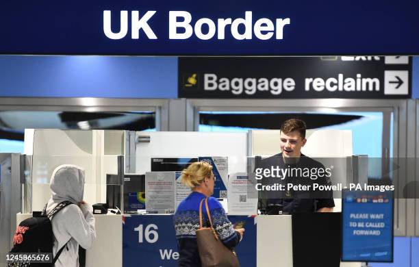 Member of the military at passport control at Manchester airport as they cover for striking Border Force officers. Public and Commercial Services...