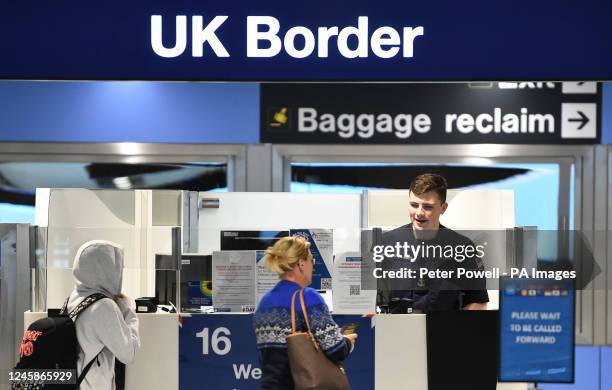 Member of the military at passport control at Manchester airport as they cover for striking Border Force officers. Public and Commercial Services...