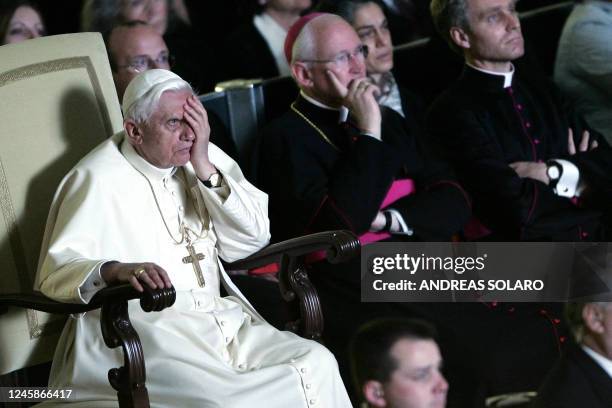 Pope Benedict XVI reacts during the movie on the life of the late Pope John Paul II "Un Papa rimasto uomo" , in Aula Nervi at the Vatican, 30 March...