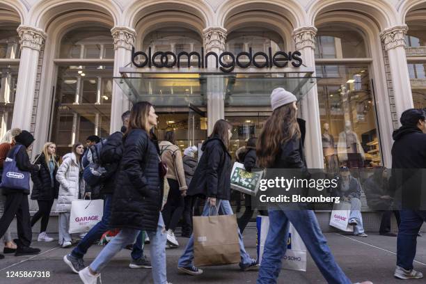 Shoppers walk past a Bloomingdale's store in the SoHo neighborhood of New York, US, on Wednesday, Dec. 28, 2022. Retail sales in the US during the...