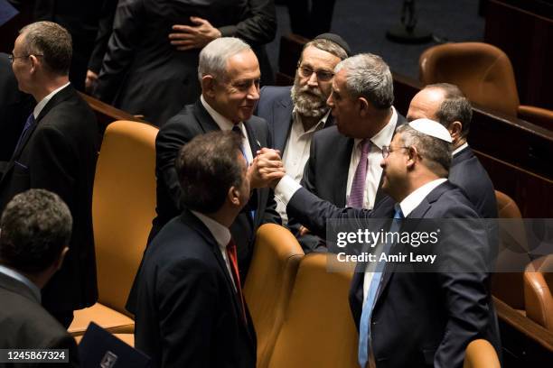 Israeli Prime Minister Benjamin Netanyahu and Minister of National Security Itamar Ben Gvir react after sworn in at the Israeli parliament during a...