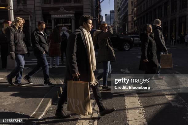 Shoppers on Broadway in the SoHo neighborhood of New York, US, on Wednesday, Dec. 28, 2022. Retail sales in the US during the holiday shopping season...