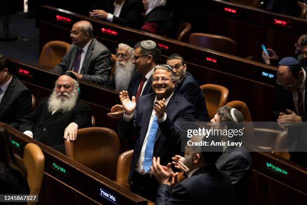 Minister of National Security Itamar Ben Gvir reacts after sworn in at the Israeli parliament during a new government sworn in discussion at the...