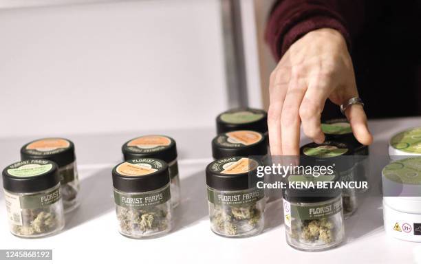 Worker set up products before a press conference at the Housing Works Cannabis Company, during the opening of the first legal cannabis dispensary in...