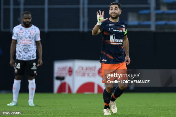 Montpellier's French midfielder Teji Savanier celebrates scoring his team's first goal during the French L1 football match between FC Lorient and...