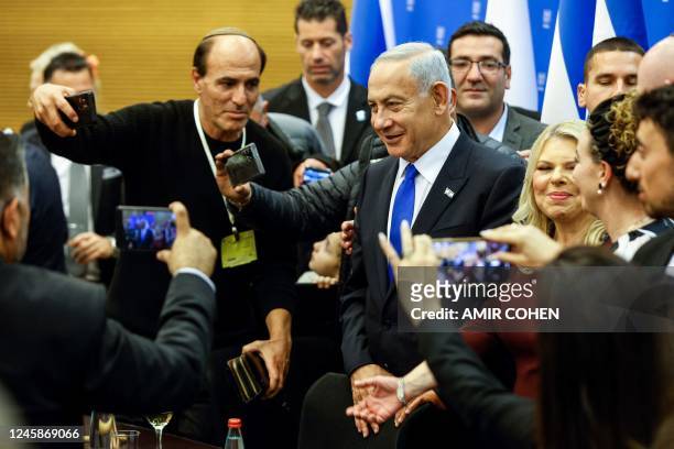 Israeli Prime Minister Benjamin Netanyahu and his wife Sara attend a toast for the new Speaker of the Knesset Amir Ohana after the new government is...