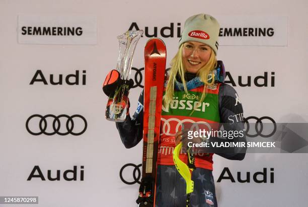 Winner USA's Mikaela Shiffrin celebrates on the podium after the second run of the slalom event during the FIS Alpine Skiing Women's World Cup in...