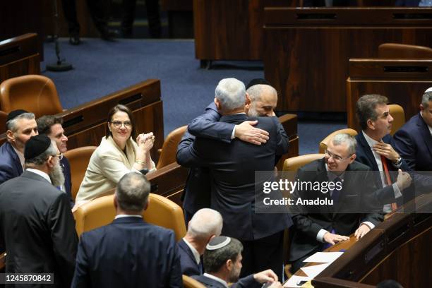 Government members congratulate Israeli Prime Minister-designate Benjamin Netanyahu at the Israeli parliament in Jerusalem on December 29, 2022. The...