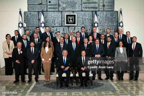 Israeli Prime Minister Benjamin Netanyahu, Israeli President Isaac Herzug and members of the new Israeli government pose for a traditional photo at...