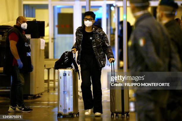 Chinese traveller leaves the arrival hall of RomeFiumicino International Airport, near Rome, on December 29, 2022 after being tested for the Covid-19...