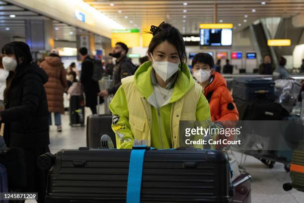 People arrive at Heathrow airport on a flight from Shanghai on December 29, 2022 in London, United Kingdom. Following China's announcement earlier...