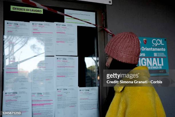 Girl looks at the job offers at the entrance to the Cinecittà Employment Centre, on December 29, 2022 in Rome, Italy. The Employment Centers - heirs...