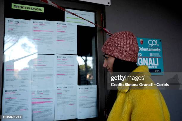 Girl looks at the job offers at the entrance to the Cinecittà Employment Centre, on December 29, 2022 in Rome, Italy. The Employment Centers - heirs...