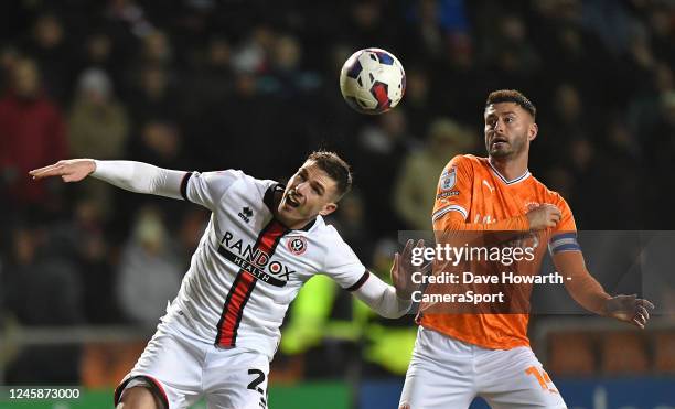 Blackpool's Gary Madine battles with Sheffield United's Ciaran Clark during the Sky Bet Championship between Blackpool and Sheffield United at...