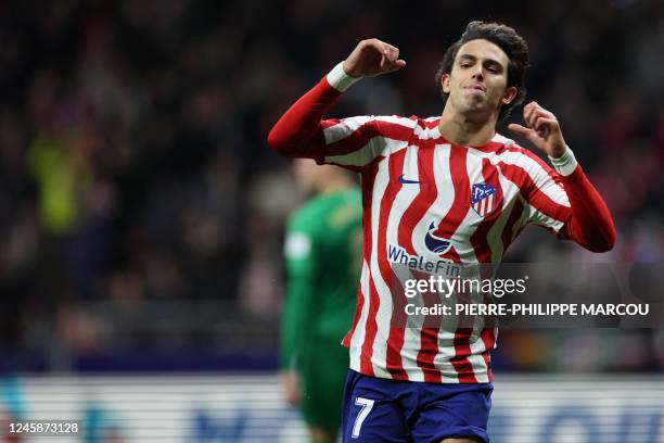 Atletico Madrid's Portuguese forward Joao Felix celebrates scoring the opening goal during the Spanish League football match between Club Atletico de...