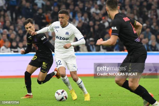 Marseille's French forward Salim Ben Seghir runs with the ball during the French L1 football match between Olympique de Marseille and Toulouse FC at...