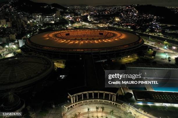 Maracana stadium is illuminated with a golden light in honour of Brazilian football legend Pele, in Rio de Janeiro, Brazil on December 29 on the day...